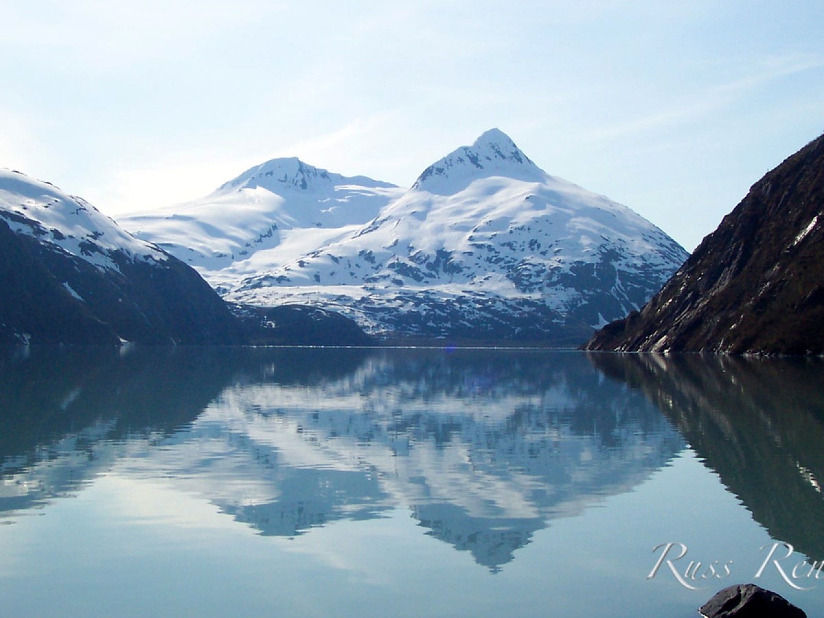 Mountain beyond a serene body of water